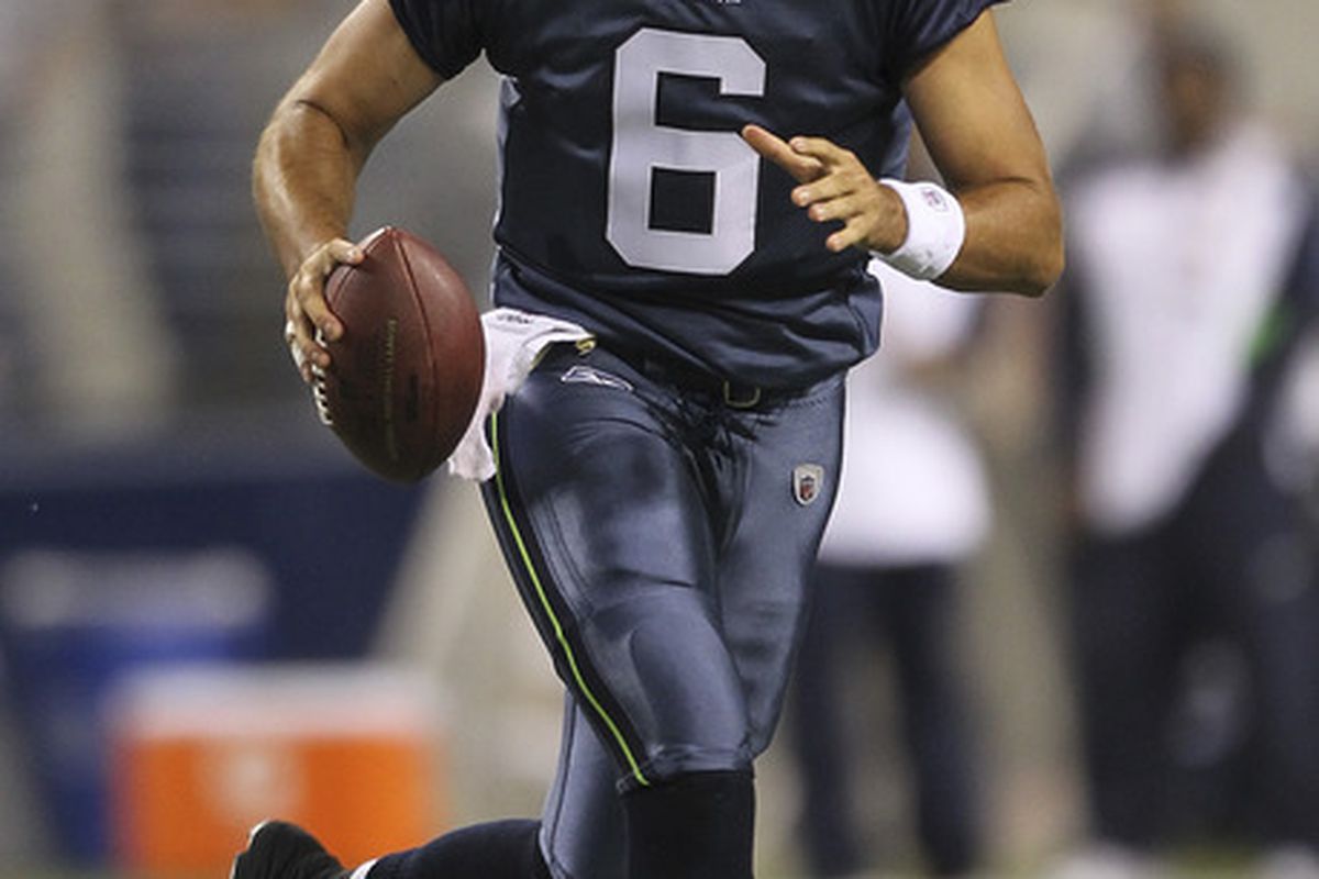 SEATTLE - SEPTEMBER 02:  Quarterback Charlie Whitehurst #6 of the Seattle Seahawks rushes against the Oakland Raiders at CenturyLink Field on September 2, 2011 in Seattle, Washington. (Photo by Otto Greule Jr/Getty Images)