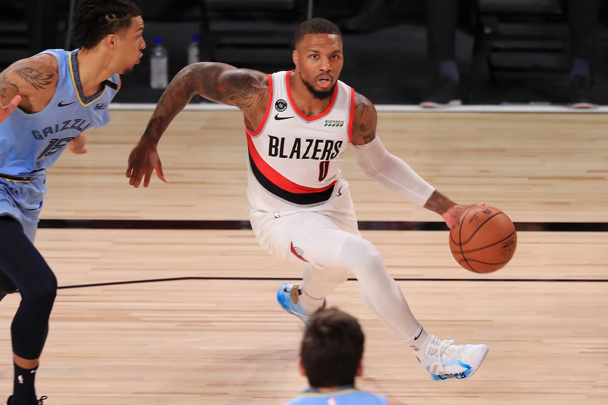Damian Lillard of the Portland Trail Blazers dribbles during the first half against the Memphis Grizzlies at The Arena at ESPN Wide World Of Sports Complex on July 31, 2020 in Lake Buena Vista, Florida.