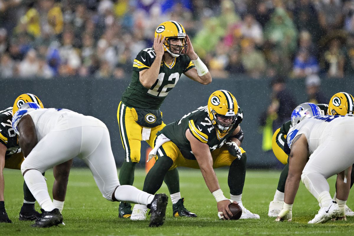 Aaron Rodgers #12 of the Green Bay Packers at the line of scrimmage during a game against the Detroit Lions at Lambeau Field on September 20, 2021 in Green Bay, Wisconsin.