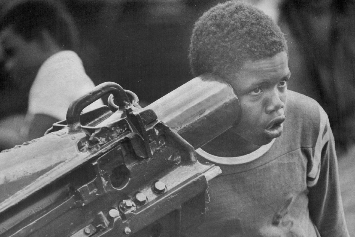 JUN 27 1976, JUN 28 1976; Getting Within Hearing Distance; Curtice Gaines, 13, holds his ear to one