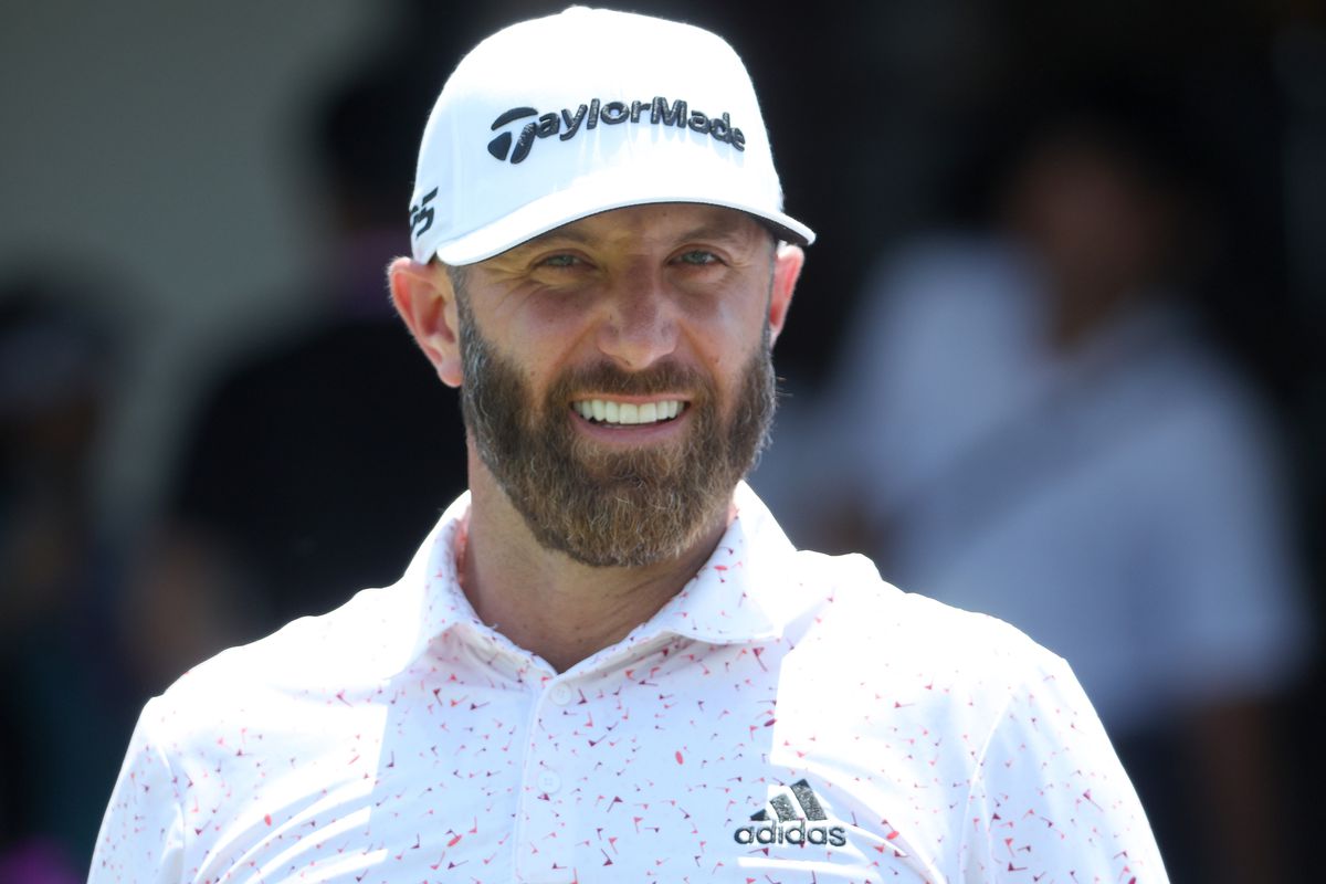 Dustin Johnson of the United States smiles on the first tee during a practice round prior to the start of the 2022 PGA Championship at Southern Hills Country Club on May 18, 2022 in Tulsa, Oklahoma.