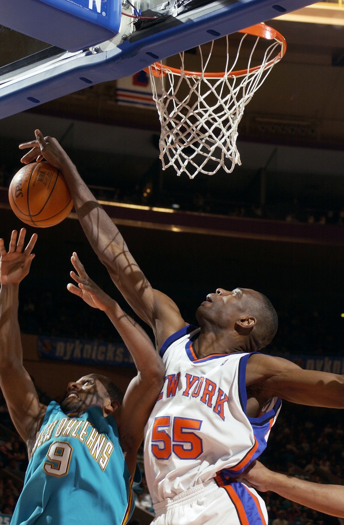 New York Knicks’ Dikembe Mutombo blocks New Orleans Hornets’