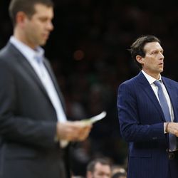 Boston Celtics head coach Brad Stevens, left, and Utah Jazz head coach Quin Snyder stand courtside during the first half on an NBA basketball game in Boston, Saturday, Nov. 17, 2018. (AP Photo/Michael Dwyer)