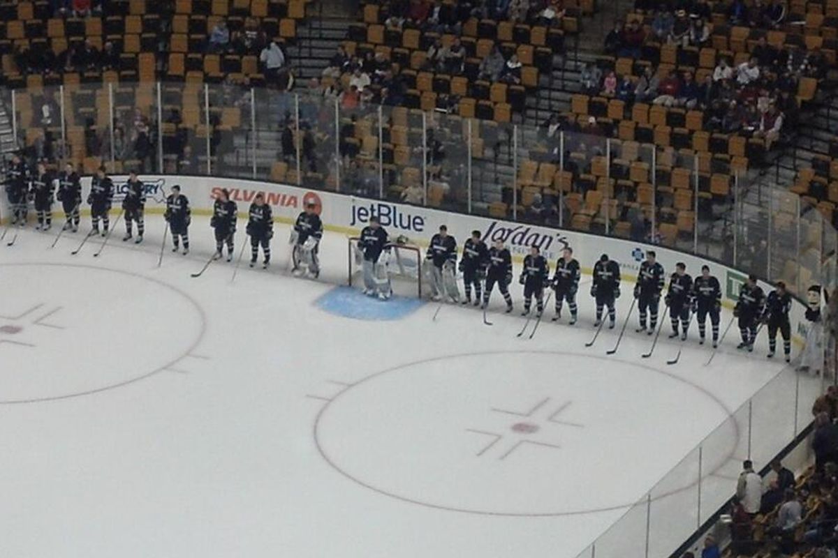 Providence College players line up for the starting lineups to be announced prior to the 2013 Hockey East Semifinals against UMass-Lowell at the TD Garden.