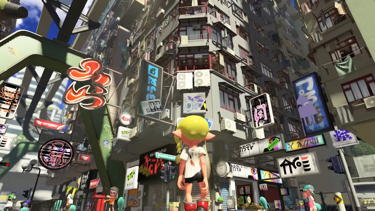 A yellow haired Octoling staring at highrises in a city, many of which have signs written in a fictional in-game language, in Splatoon 3.