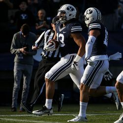 Brigham Young Cougars linebacker Francis Bernard (13) scores a touchdown, putting BYU up 34-9 after the PAT, during a game against the UMass Minutemen at LaVell Edwards Stadium in Provo on Saturday, Nov. 19, 2016.