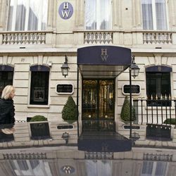 FILE - This Friday,  Dec. 5, 2008 file photo shows the entrance of the Harry Winston jewelry store near the Champs-Elysees in Paris. Eight men charged in one of the world’s biggest jewel heists went on trial in Paris on Tuesday Feb. 3, 2015 accused of stealing more than 100 million euros worth of luxury watches, necklaces, earrings and other valuables from a Harry Winston boutique in two audacious operations. 