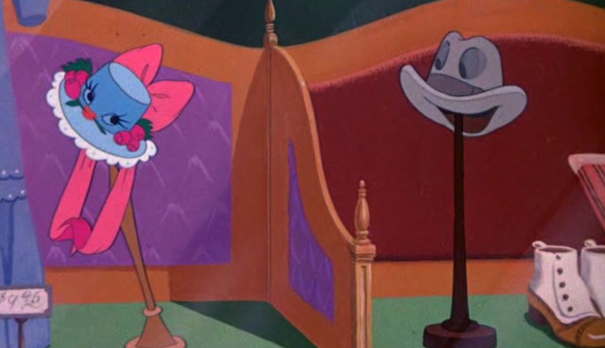 A cartoon ladies’ hat with round eyes, long eyelashes, a big pink ribbon on top, and flowers around the lacy blue brim makes a flirtatious face at an eagerly grinning plain grey fedora in the shop display next to hers in the Disney short “Johnnie Fedora and Alice Bluebonnet”