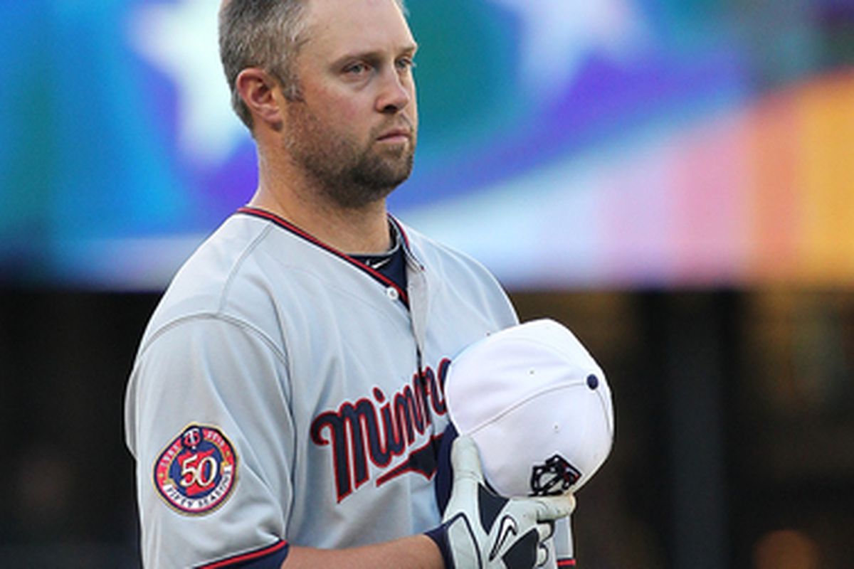 SEATTLE - MAY 31:  Michael Cuddyer #5 of the Minnesota Twins stands during a Memorial Day tribute prior to a game against the Seattle Mariners at Safeco Field on May 31, 2010 in Seattle, Washington. (Photo by Otto Greule Jr/Getty Images)