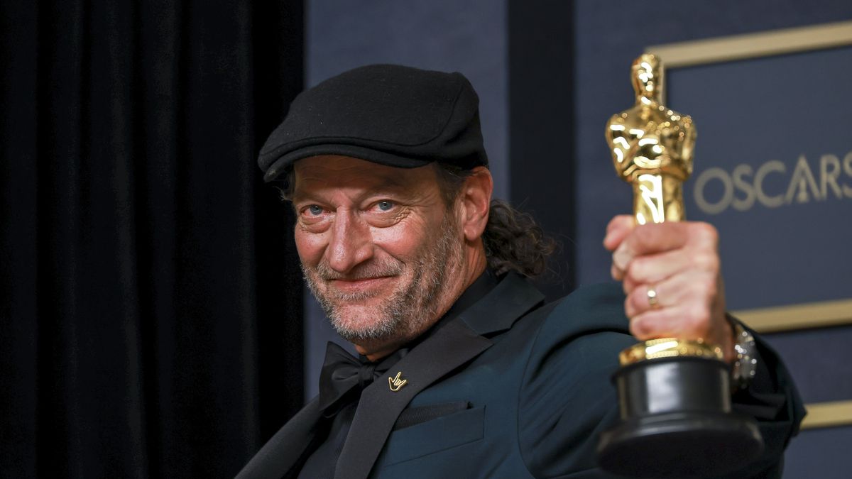 CODA co-star Troy Kotsur holds up his Best Supporting Actor statuette at the 94th annual Academy Awards