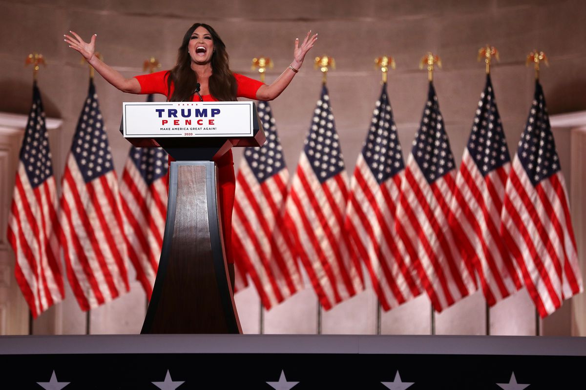 Standing behind a podium and in front of a long row of American flags, Kimberly Guilfoyle pre-records her address to the Republican National Convention at the Mellon Auditorium on August 24, 2020 in Washington, DC.