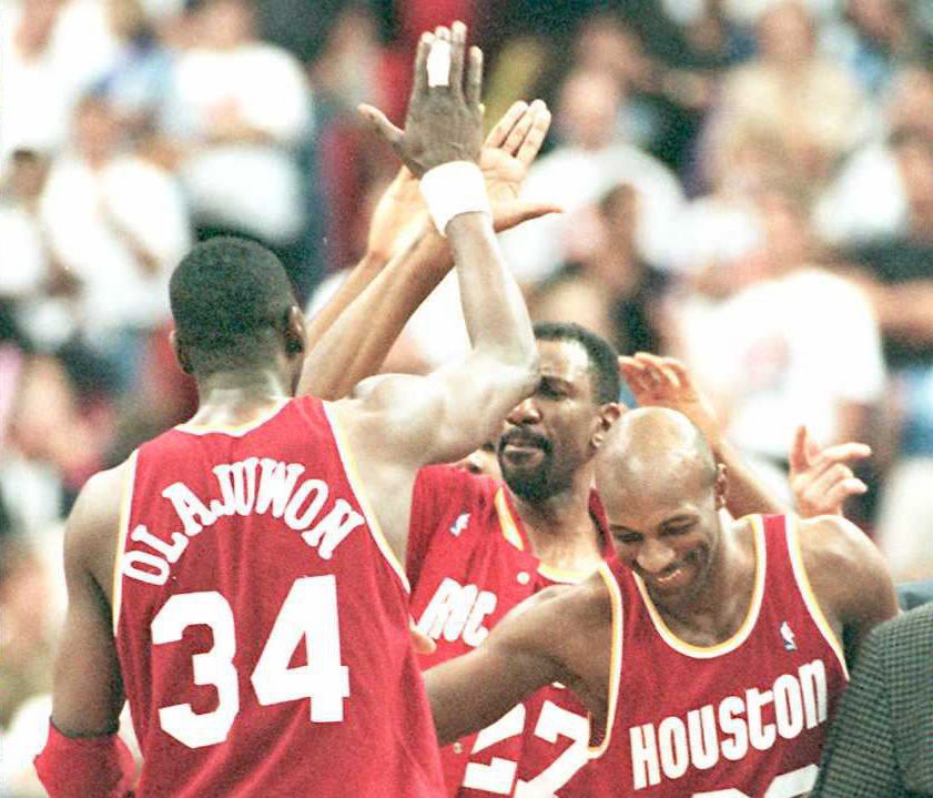 Houston Rockets Hakeem Olajuwon gets mobbed by tea