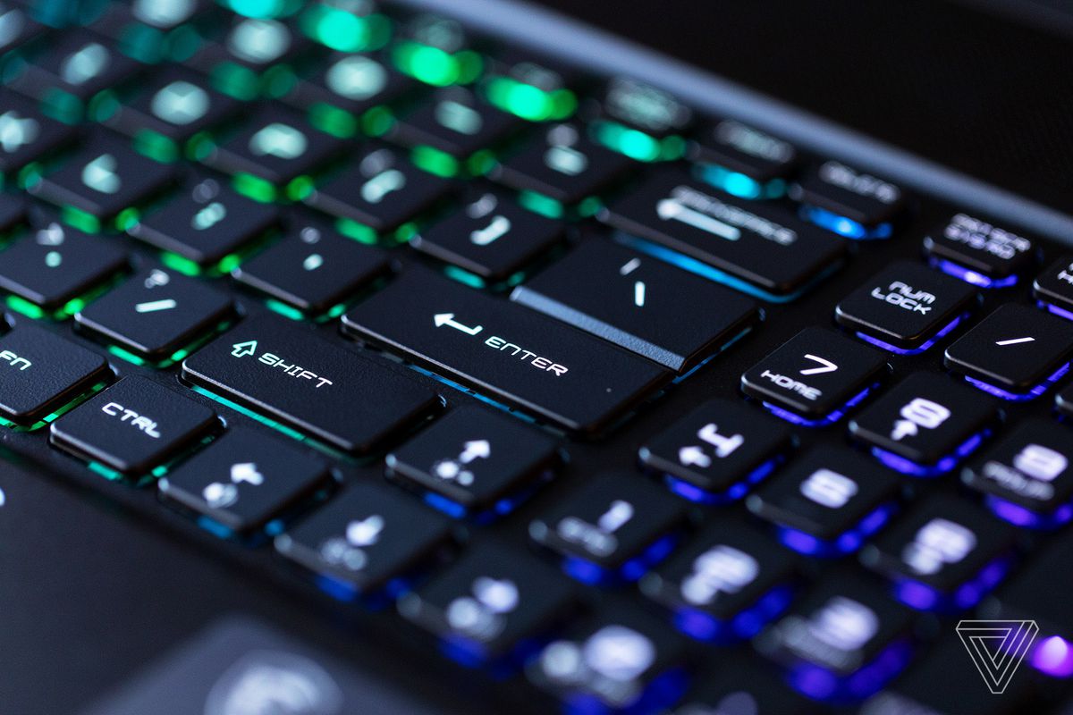 The number pad on the MSI GS76 Stealth keyboard. The keys are illuminated in green and purple.