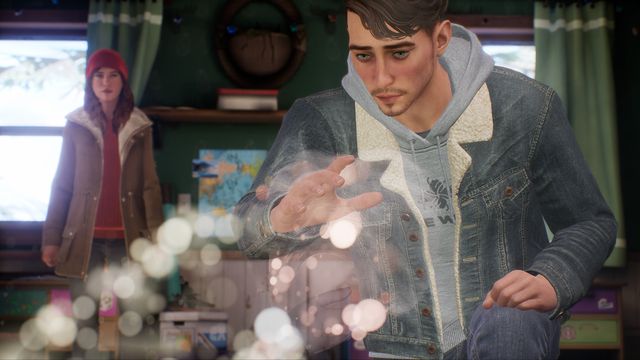 Tell Me Why - Tyler Ronan, a young trans man with short hair and a beard, looks over a shimmering telepathic image while his sister stands in the background.