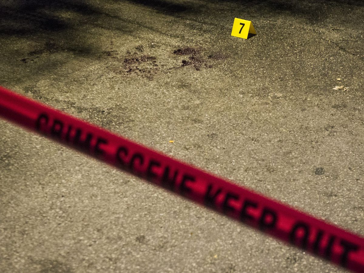 Evidence marker seven marks blood at the scene where four people were shot Sunday night in the 2200 block of South Sacramento in Chicago. | Tyler LaRiviere/Sun-Times