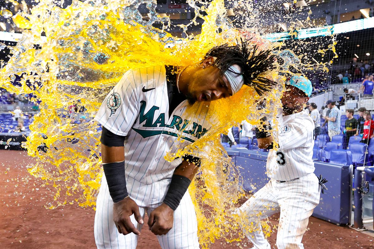 Luis Arraez #3 of the Miami Marlins gives teammate Jean Segura #9 a Gatorade bath after defeating the Chicago Cubs at loanDepot park on April 28, 2023 in Miami, Florida.