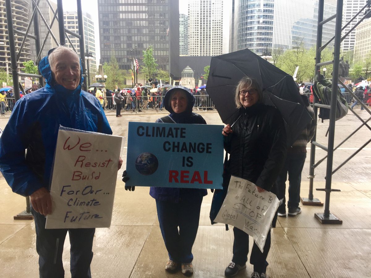 From left: Eugene Wollaston, Anna Gifford and Jeanie Guenther each came in from various suburbs to join several thousand other marcher Saturday. | Sam Charles/Sun-Times