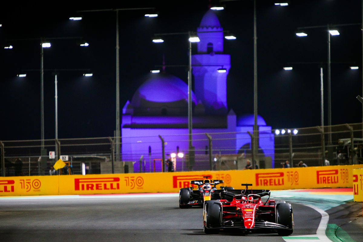 Charles Leclerc of Ferrari and Monaco leads Max Verstappen of Red Bull Racing and The Netherlands during the F1 Grand Prix of Saudi Arabia at the Jeddah Corniche Circuit on March 27, 2022 in Jeddah, Saudi Arabia.