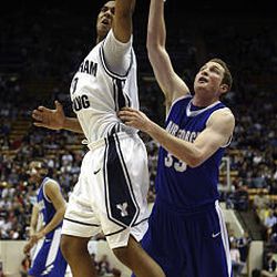 Brandon Davies, left, takes the rebound against Mike McClain of Air Force at the BYU Marriott Center in Provo on Saturday.  BYU won 91-48.