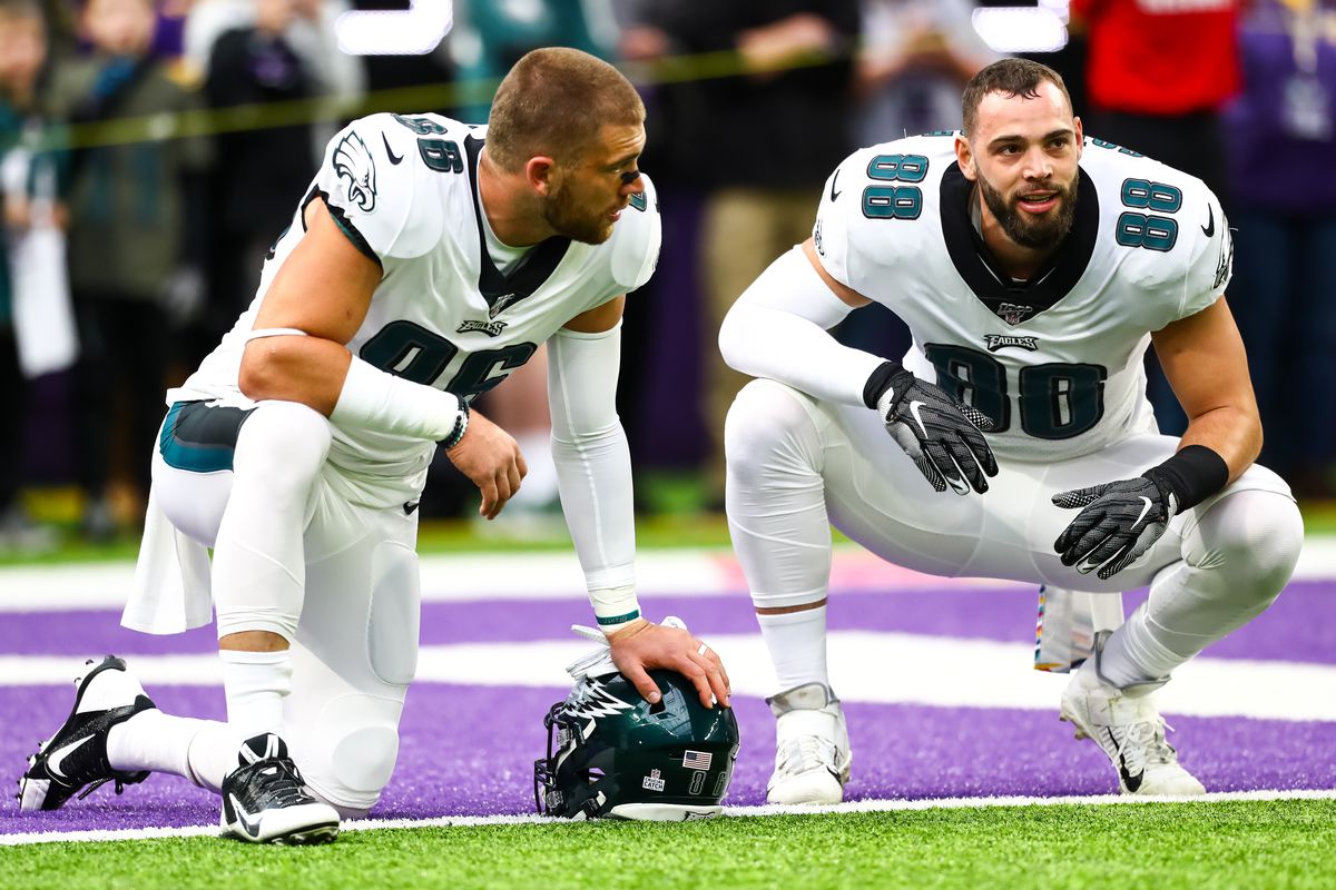 Philadelphia Eagles tight end Zach Ertz and tight end Dallas Goedert talk before the start of a game against the Minnesota Vikings at U.S. Bank Stadium.