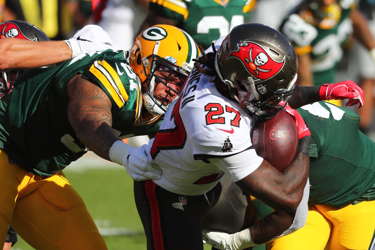 Green Bay Packers inside linebacker Krys Barnes (51) tackles Tampa Bay Buccaneers running back Ronald Jones (27) during the first quarter of a NFL game at Raymond James Stadium.&nbsp;