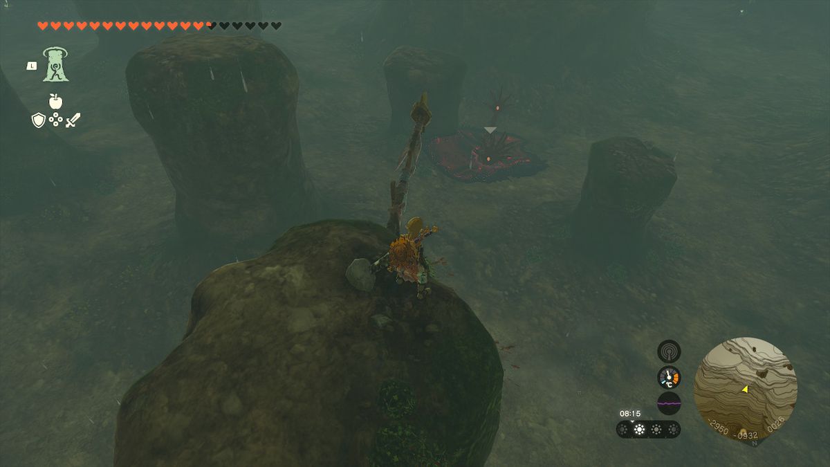 Link perches on a ledge above Gloom Hands in the Tamio River Downstream Cave in Zelda Tears of the Kingdom.