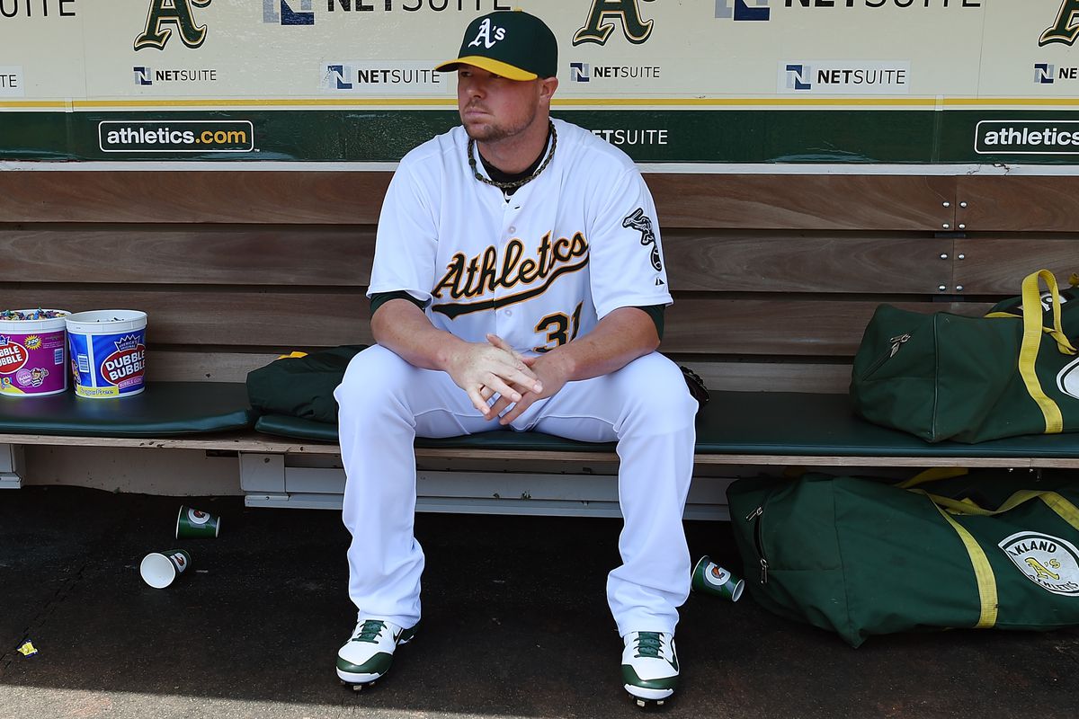 Jon Lester, lost in thought in Oakland. Is he contemplating coming to Chicago?
