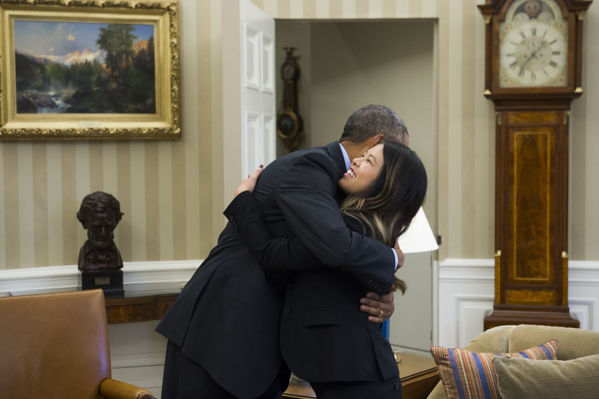 President Obama hugs Nina Pham.