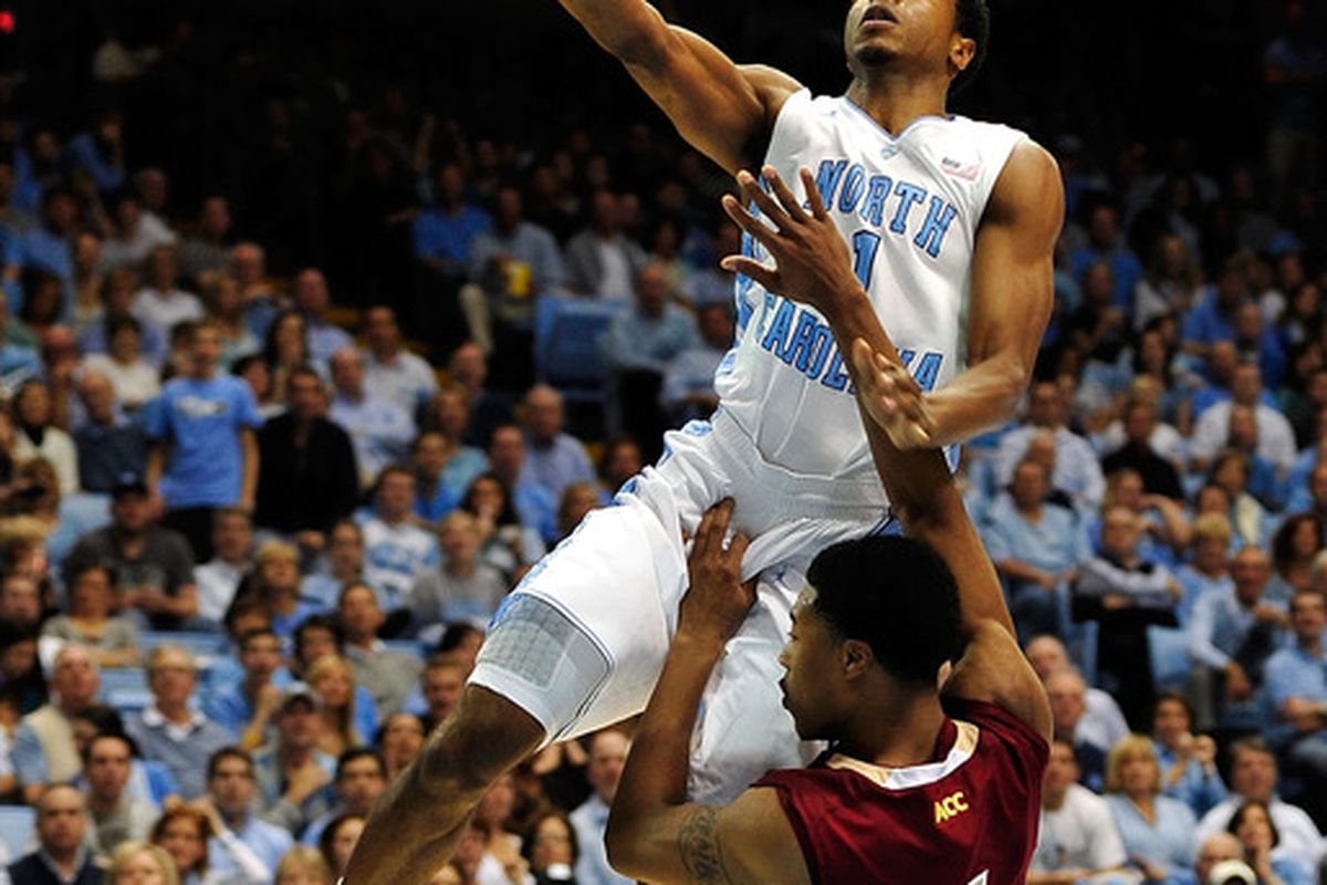 Dexter Strickland  drives against defender Gabe Moton #1 of the Boston College Eagles during play at the Dean Smith Center. North Carolina won 83-60.