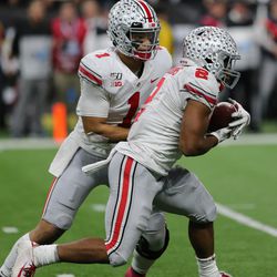 Justin Fields (#1) and J.K. Dobbins (#2) accounted for 472 net yards of offense vs UW. 