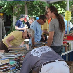 Central Book Exchange in Sugar House hosts an annual book sale Saturday, Aug, 3, 2013, with over 50,000 books. Many of the books had been boxed for 10 to 25 years.
