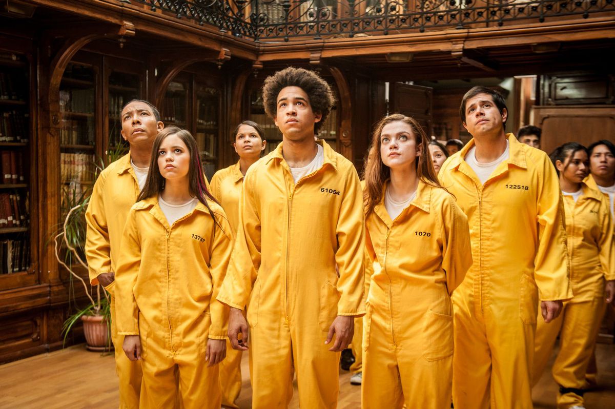 A group of teenagers wearing yellow overalls