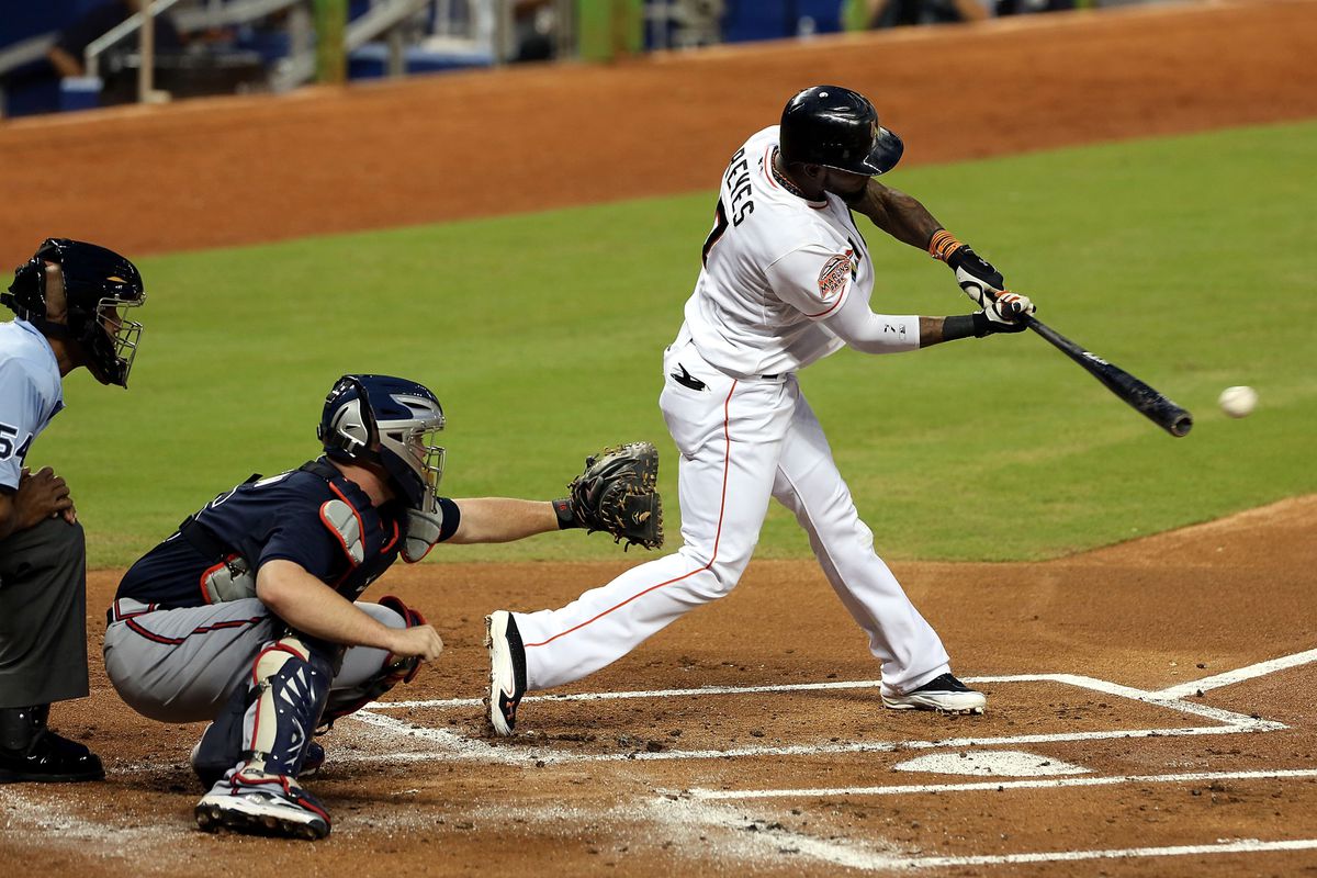MIAMI, FL - SEPTEMBER 18: Jose Reyes #7 of the Miami Marlins gets a hit against theAtlanta Braves at Marlins Park on September 18, 2012 in Miami, Florida.  (Photo by Marc Serota/Getty Images)
