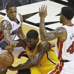 Miami Heat power forward Udonis Haslem (40) Miami Heat point guard Mario Chalmers (15) Indiana Pacers center Roy Hibbert (55) vie for the ball during the first half of Game 7 in their NBA basketball Eastern Conference finals playoff series, Monday, June 3, 2013 in Miami.
