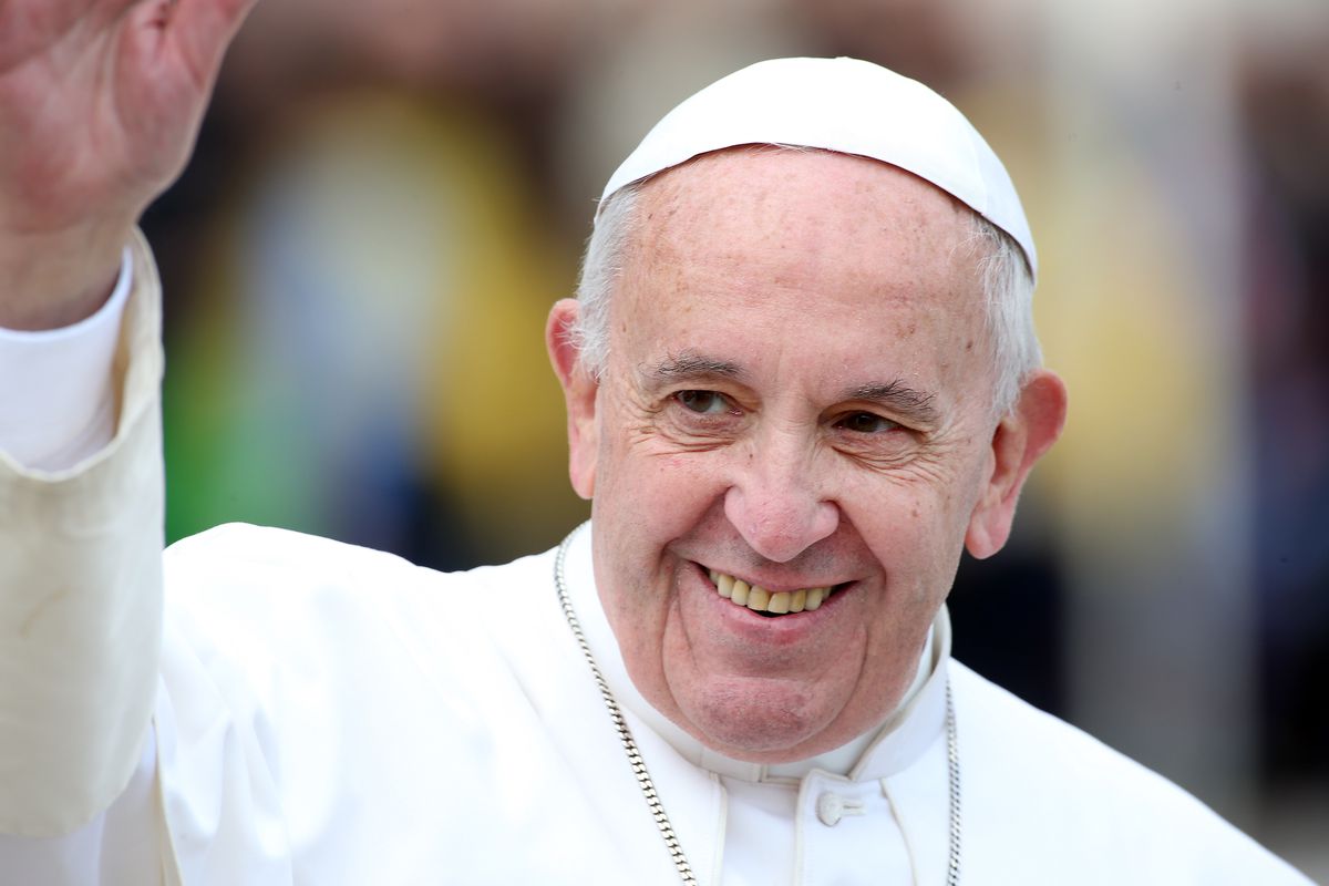 Pope Francis raising hand