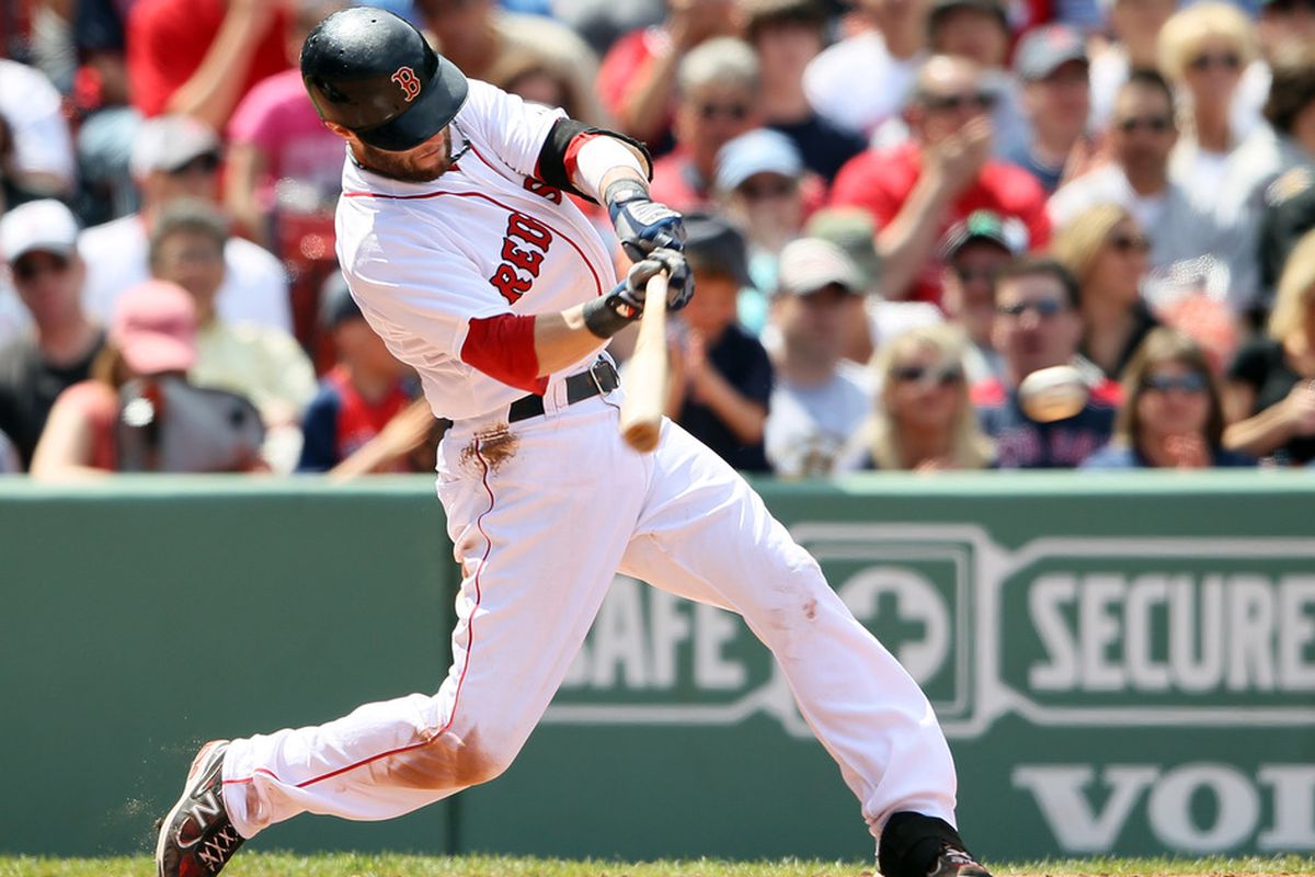 BOSTON, MA - JUNE 04:  Dustin Pedroia #15 of the Boston Red Sox gets an RBI single against the Oakland Athletics on June 4, 2011 at Fenway Park in Boston, Massachusetts.  (Photo by Elsa/Getty Images)