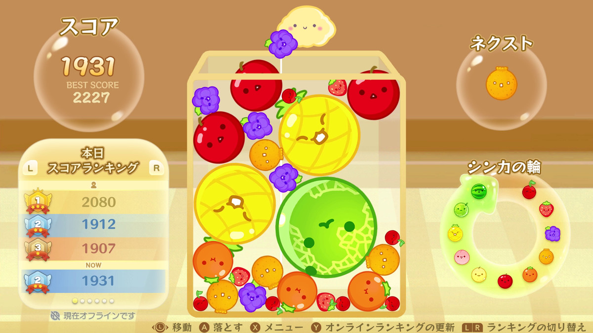Several fruit surround a honeydew melon in Suika Game