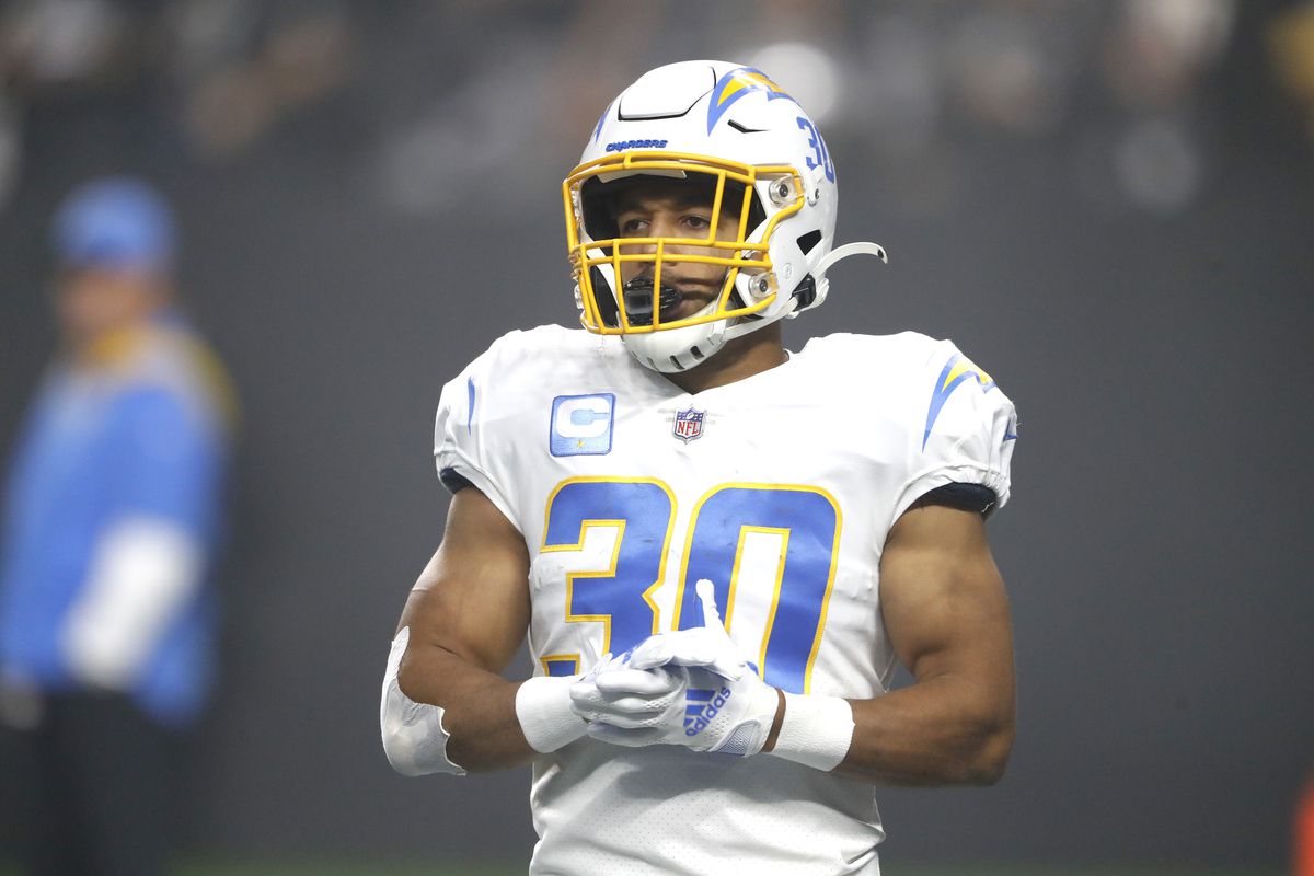 Running back Austin Ekeler #30 of the Los Angeles Chargers warms up before a game against the Las Vegas Raiders at Allegiant Stadium on January 09, 2022 in Las Vegas, Nevada.