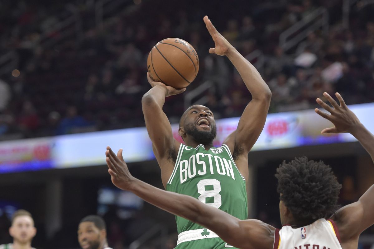 Boston Celtics guard Kemba Walker shoots against Cleveland Cavaliers guard Collin Sexton in the fourth quarter at Rocket Mortgage FieldHouse.