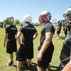 Players work out during All Poly Camp in Layton Thursday, June 20, 2013.