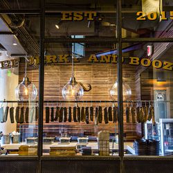 Authentic South African jerky hangs in the window at Biltong Bar.
