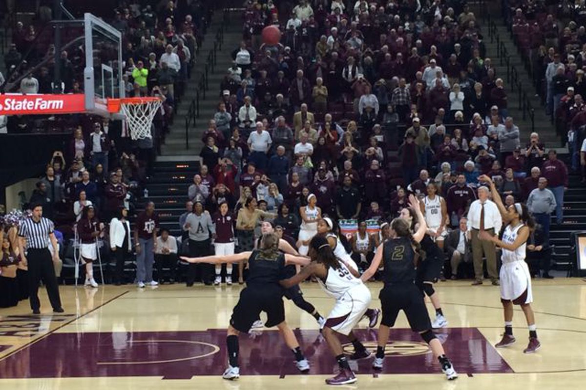 Curtyce Knox shoots to give the Ags a late lead while the injured Jordan Jones watches from the bench