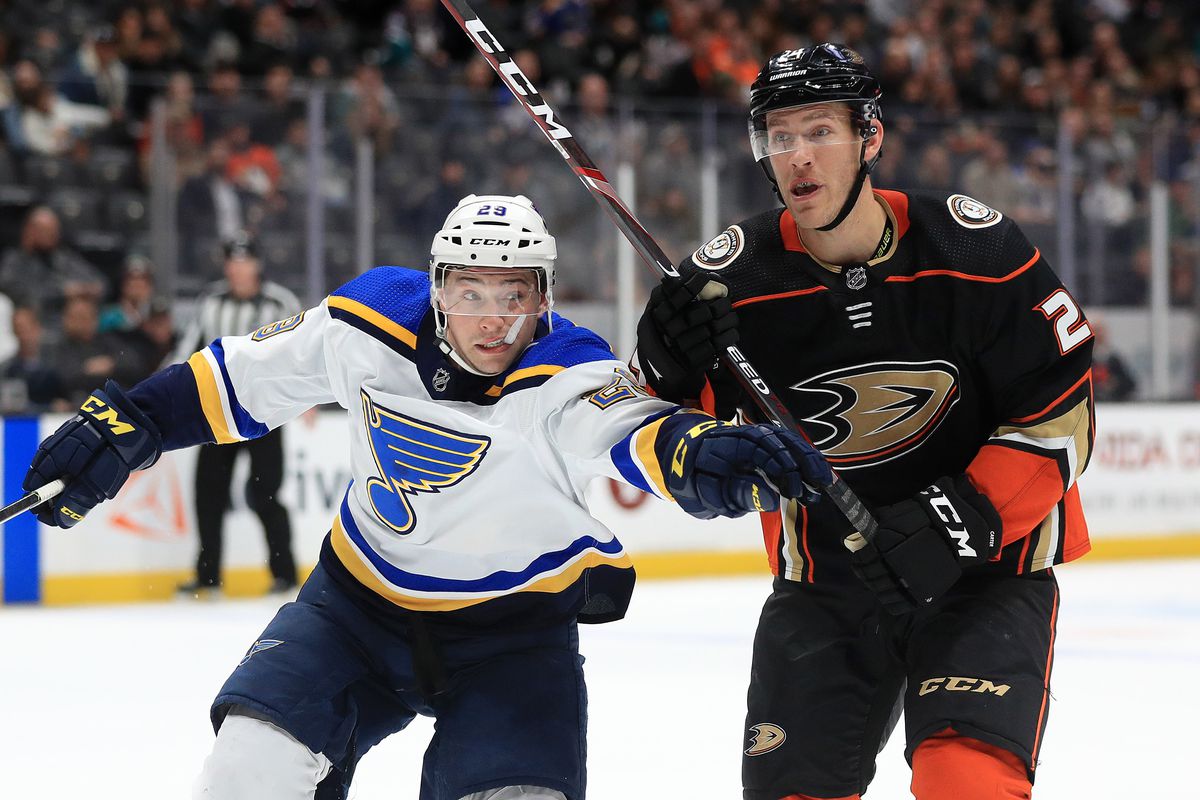 Vince Dunn #29 of the St. Louis Blues pushes Carter Rowney #24 of the Anaheim Ducks during the second period of a game at Honda Center on March 11, 2020 in Anaheim, California.
