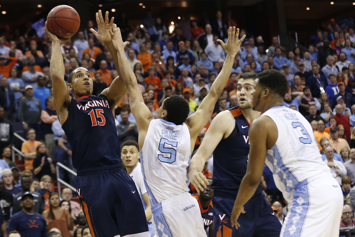 Mar 12, 2016; Washington, DC, USA; Virginia Cavaliers guard Malcolm Brogdon (15) shoots the ball over North Carolina Tar Heels guard Marcus Paige (5) in the second half during the championship game of the ACC conference tournament at Verizon Center. 