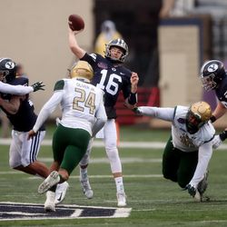 Brigham Young Cougars quarterback Baylor Romney (16) passes the ball just ahead of the Blazers rush as BYU and UAB play in the Radiance Technologies Independence Bowl in Shreveport, Louisiana, on Saturday, Dec. 18, 2021.