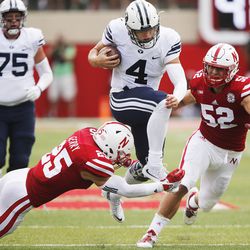 Brigham Young Cougars quarterback Taysom Hill (4) runs against Nebraska Cornhuskers safety Nate Gerry (25)  in Lincoln, NE Saturday, Sept. 5, 2015.