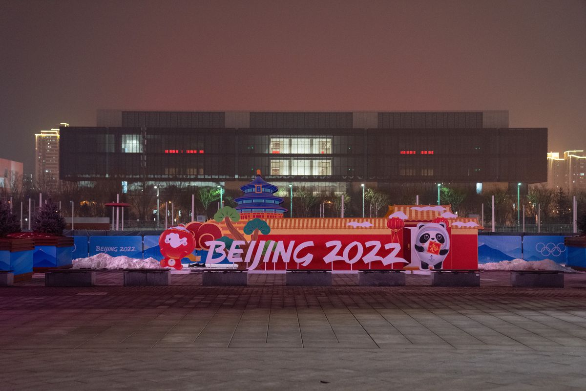 A Beijing 2022 Winter Olympics logo is displayed near the perimeter fence in the grounds of the main press centre on January 24, 2022 in Beijing, China. With just over one week to go until the opening ceremony final preparations are being made in Beijing ahead of the forthcoming 2022 Winter Olympics.