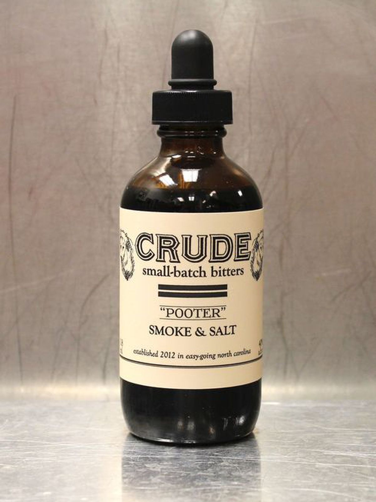A bottle of Crude bitters