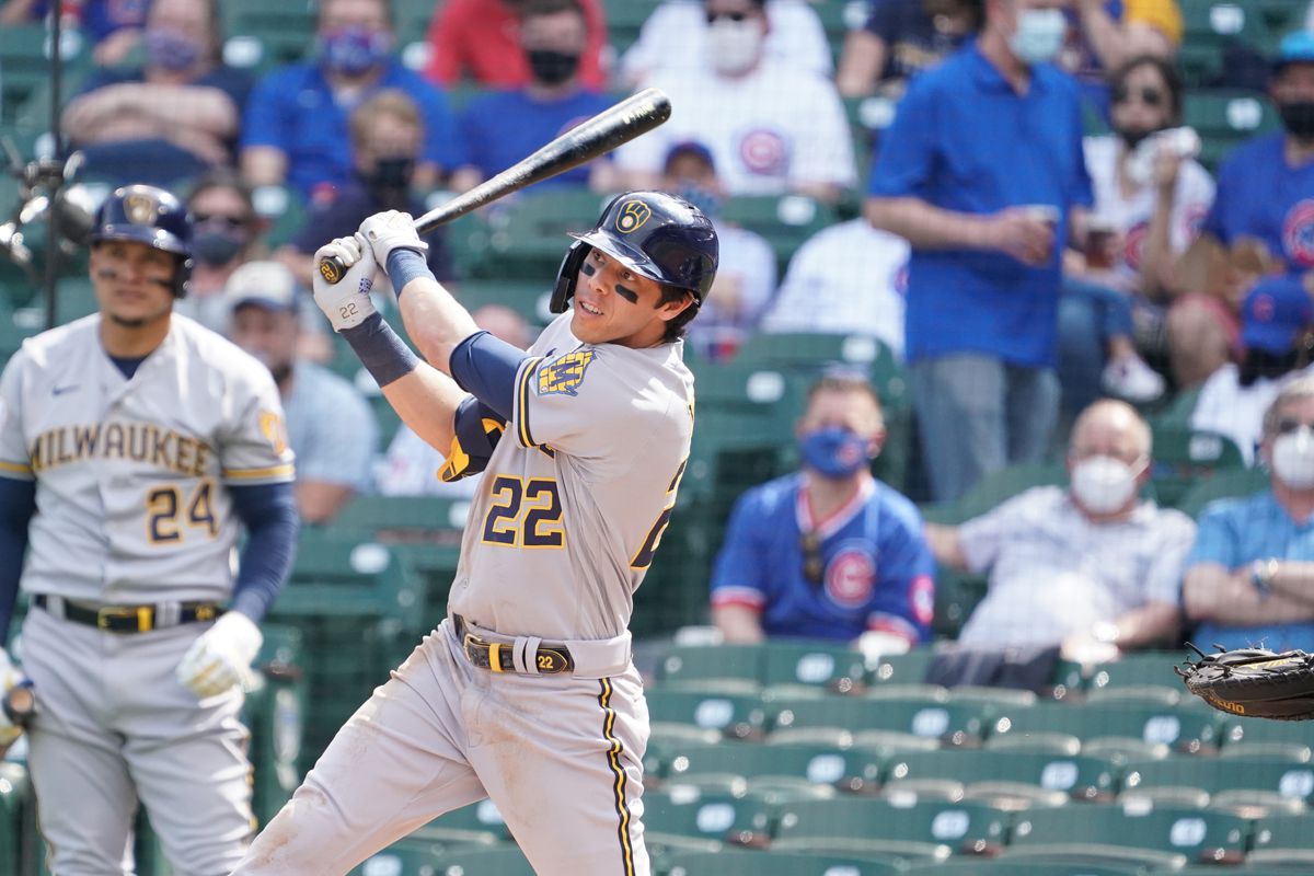Milwaukee Brewers left fielder Christian Yelich (22) hits a double against the Chicago Cubs during the fourth inning at Wrigley Field.