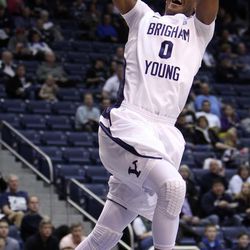 Brandon Davies of Brigham Young dunks the ball against Pepperdine during NCAA basketball in Provo, Thursday, Jan. 10, 2013.